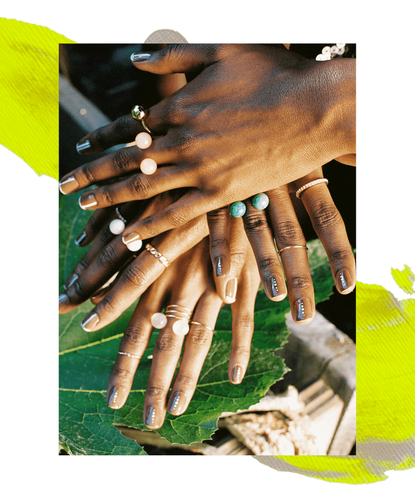 A composite of three photos featuring models’ hands. The first features a hand with a silver jeweled hand bracelet and minimal crystal nail art. The middle features four overlapping hands with delicate crystal nail art and pink and blue rings. The left features Lyric Mariah’s hand, which has a limb difference, with two fingernails painted in delicate polka-dot nail art and accessorized with gold rings.