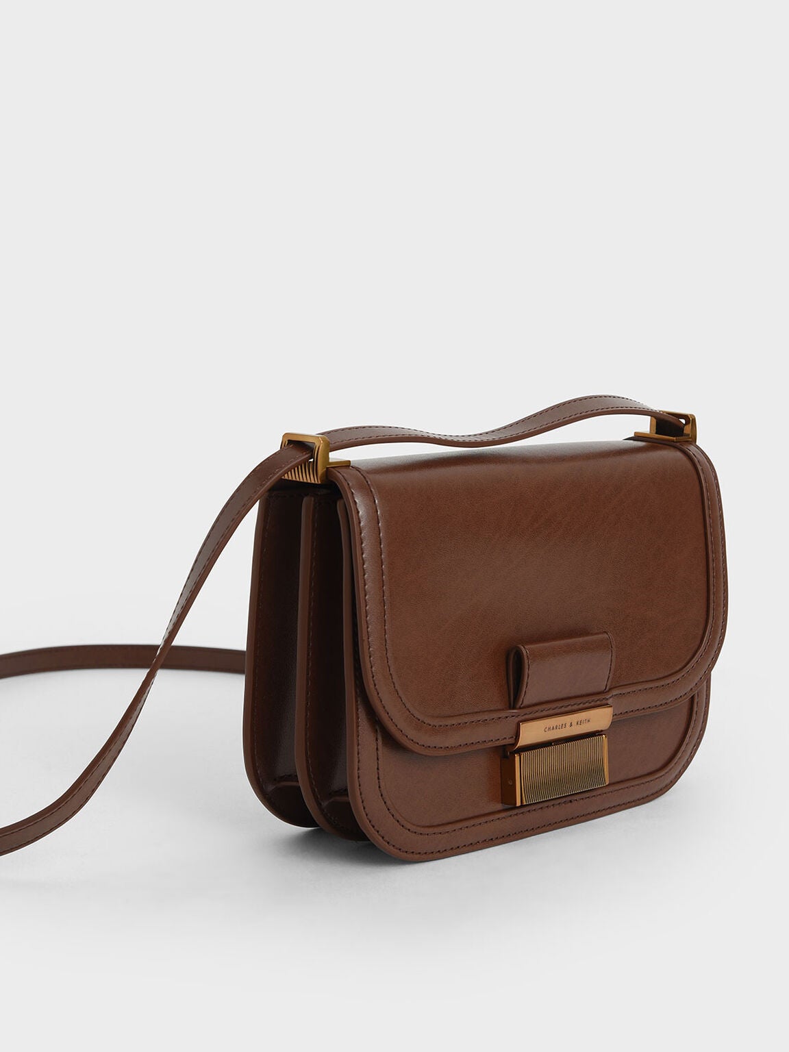 Charles Keith Metallic Push Lock Crossbody Bag