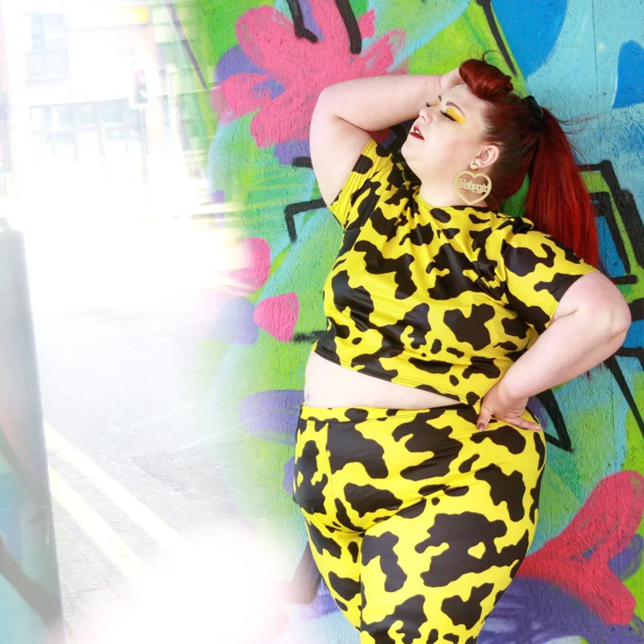 Image of Lindsay McGlone wearing a bright yellow and black patterned coord