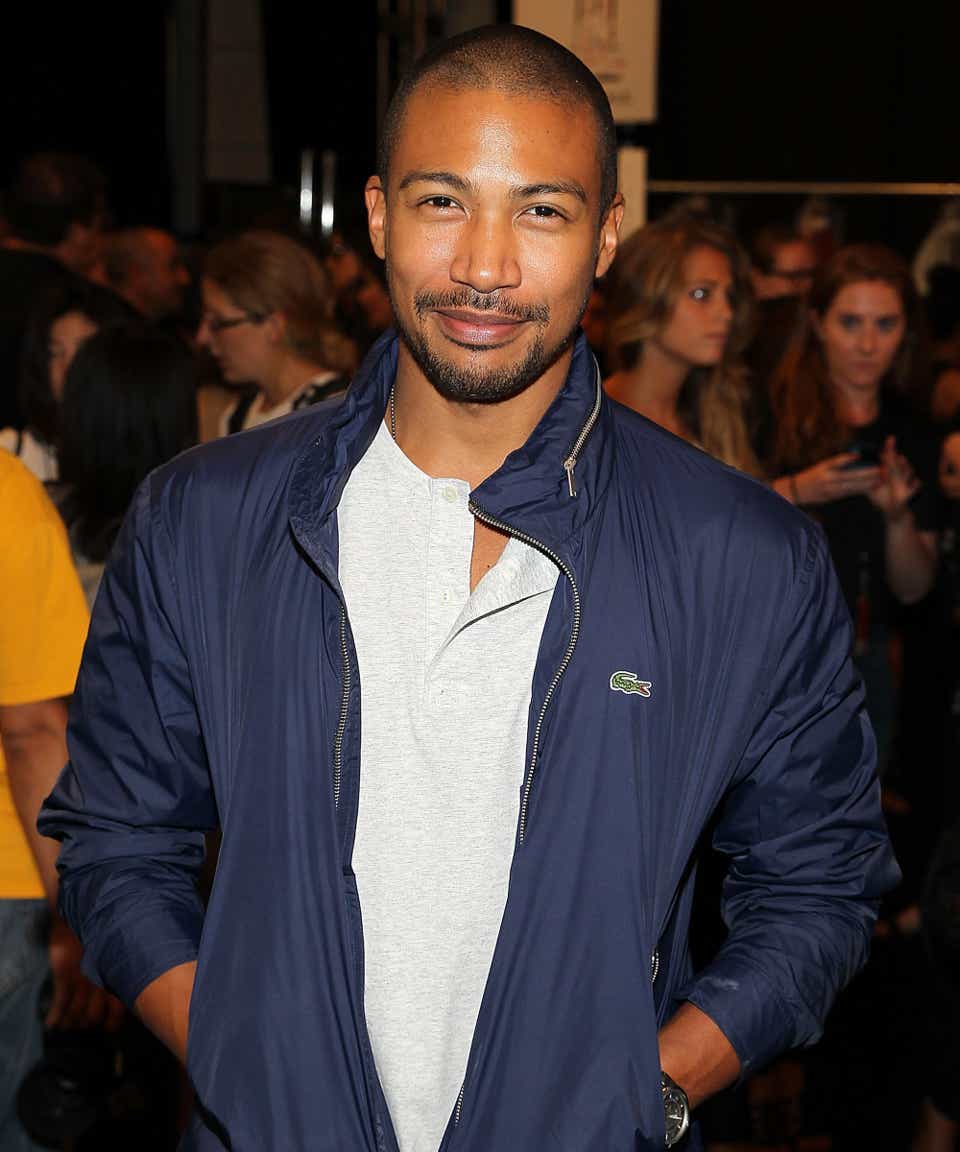 Charles Michael Davis poses for a photo backstage at the Lacoste fashion show