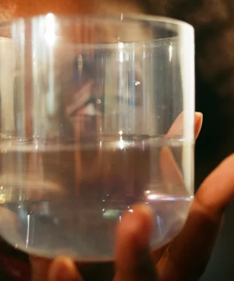 woman looking through a glass