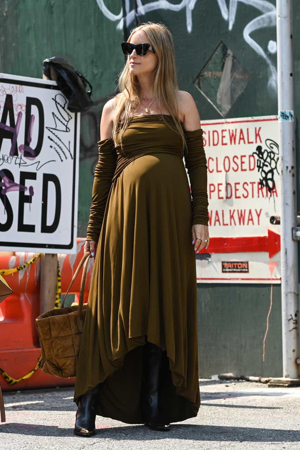 Charlotte Groeneveld is seen wearing a Khate brown dress with brown bag outside the Khaite show during New York Fashion Week