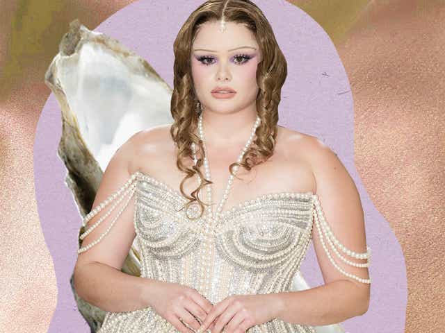 image of Barbie Ferreira at the Met Gala against a background of satin and an oyster