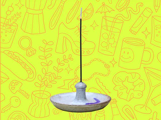 An incense bowl over a yellow background with orange line drawings of various objects Money Diarists purchase.