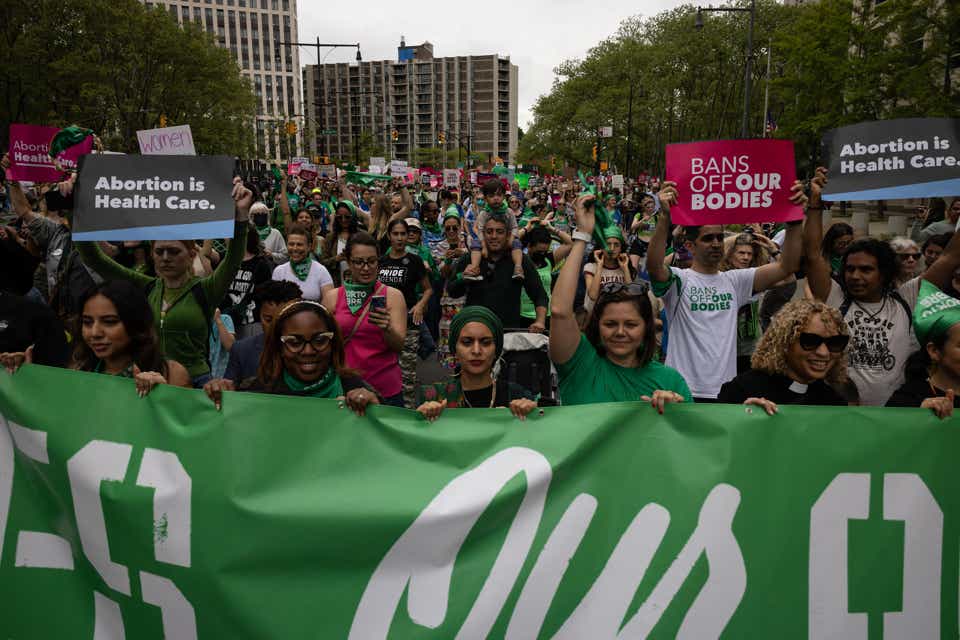 Demonstrators march during the abortion rights rally in reaction to the leak of the US Supreme Court draft abortion ruling on May 14, 2022 in Brooklyn, New York