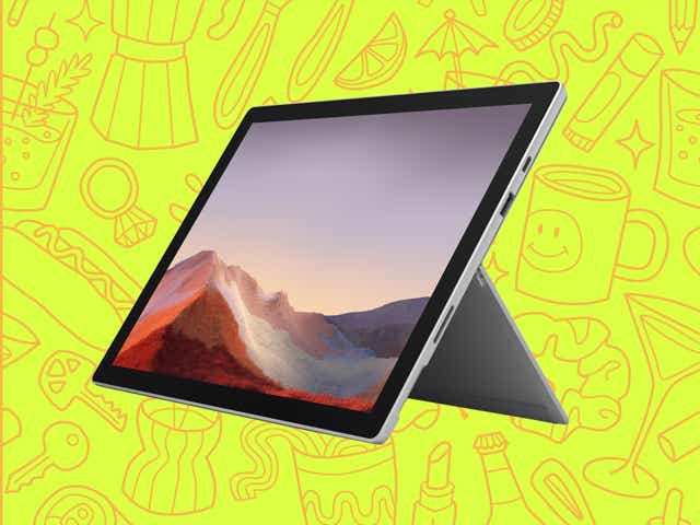 a Microsoft surface pro over a yellow background with orange line drawings of various objects Money Diarists purchase.