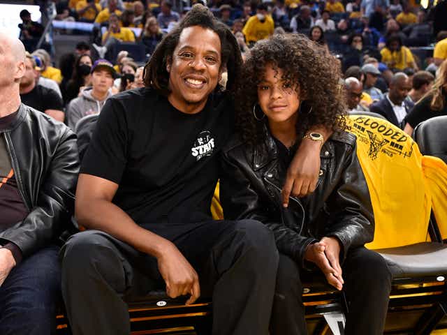 Jay-Z and his daughter Blue Ivy Carter poses for a photo during the game of the Boston Celtics against the Golden State Warriors.