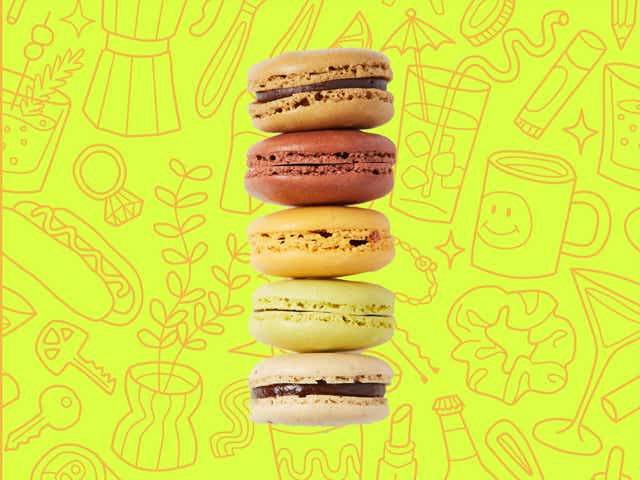macarons over a yellow background with orange line drawings of various objects Money Diarists purchase.