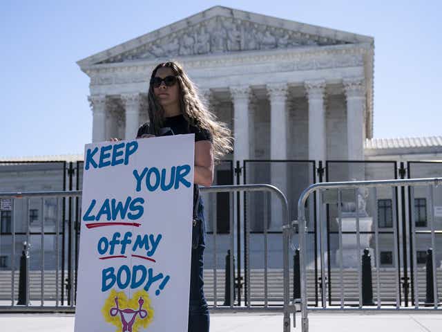 An abortion rights demonstrator holds a "Keep Your Laws Off My Body" sign outside the US Supreme Court in Washington, D.C., US, on Wednesday, May 11, 2022. Senators are expected to vote on a measure codify abortion access that was introduced after a leaked Supreme Court draft opinion in a case concerning a Mississippi ban on abortion after 15 weeks showed the court could overturn Roe v. Wade.