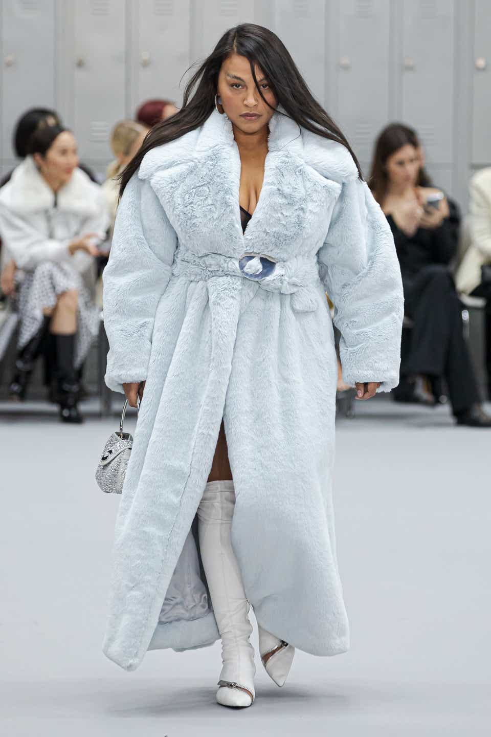 Paloma Elsesser wearing a baby blue furry coat on the Coperni runway.
