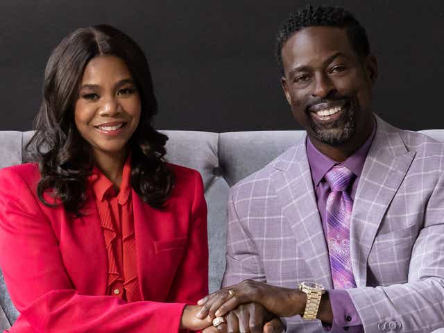 Regina Hall holding hands with Sterling K. Brown