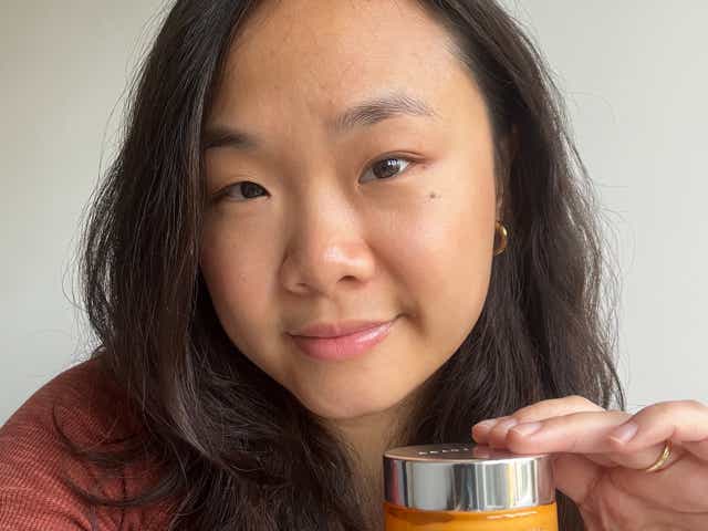 A selfie of Venus holding Beauty Pie's YOUTHBOMB cream