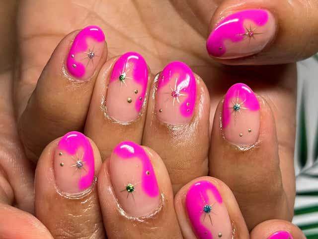 Hot pink wavy nails with glittery sparkles