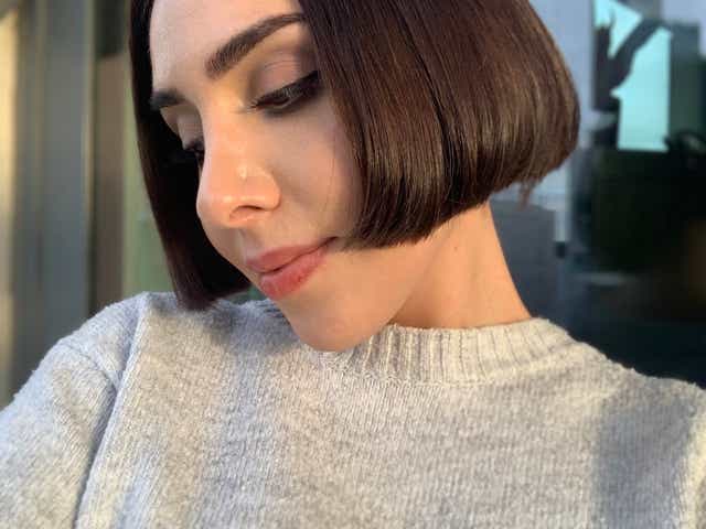 A selfie of Jackie with short, silky hair