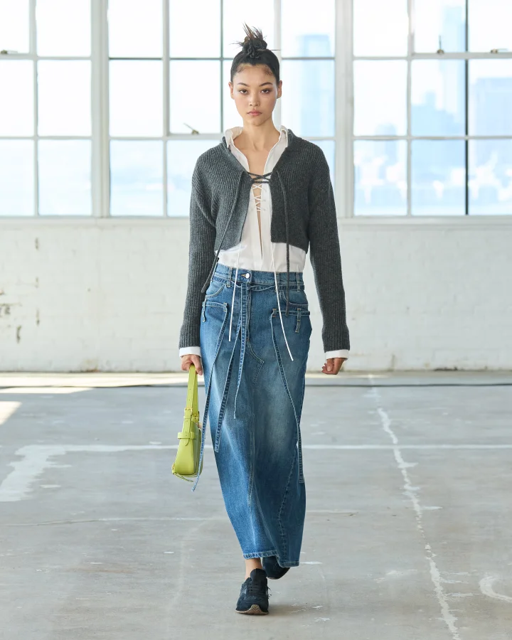 A model wearing a maxi denim skirt at the Altuzarra Spring 2023 runway.