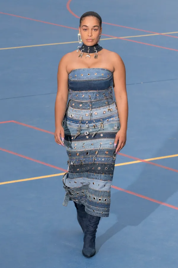 A model wearing a denim dress at the Marine Serre Spring 2023 runway.