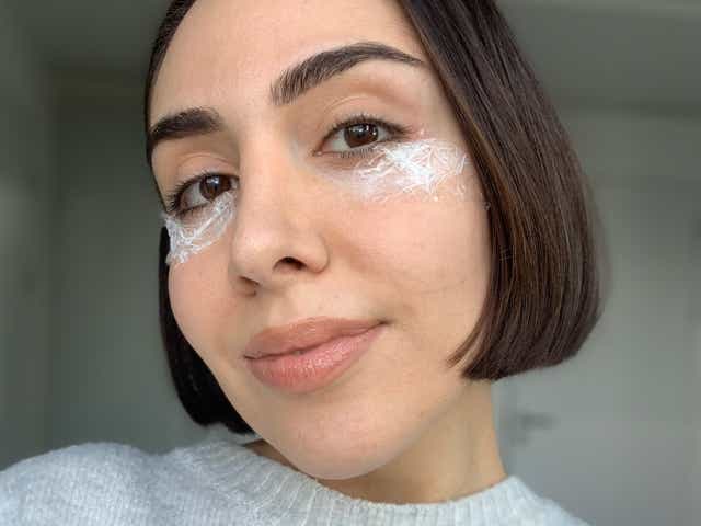 Selfie of Jacqueline with cling film over her eye area with cream underneath