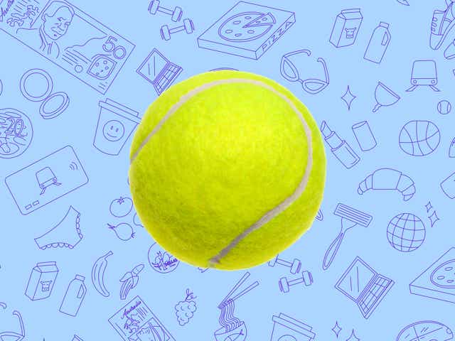 A bright yellow tennis ball against a blue background