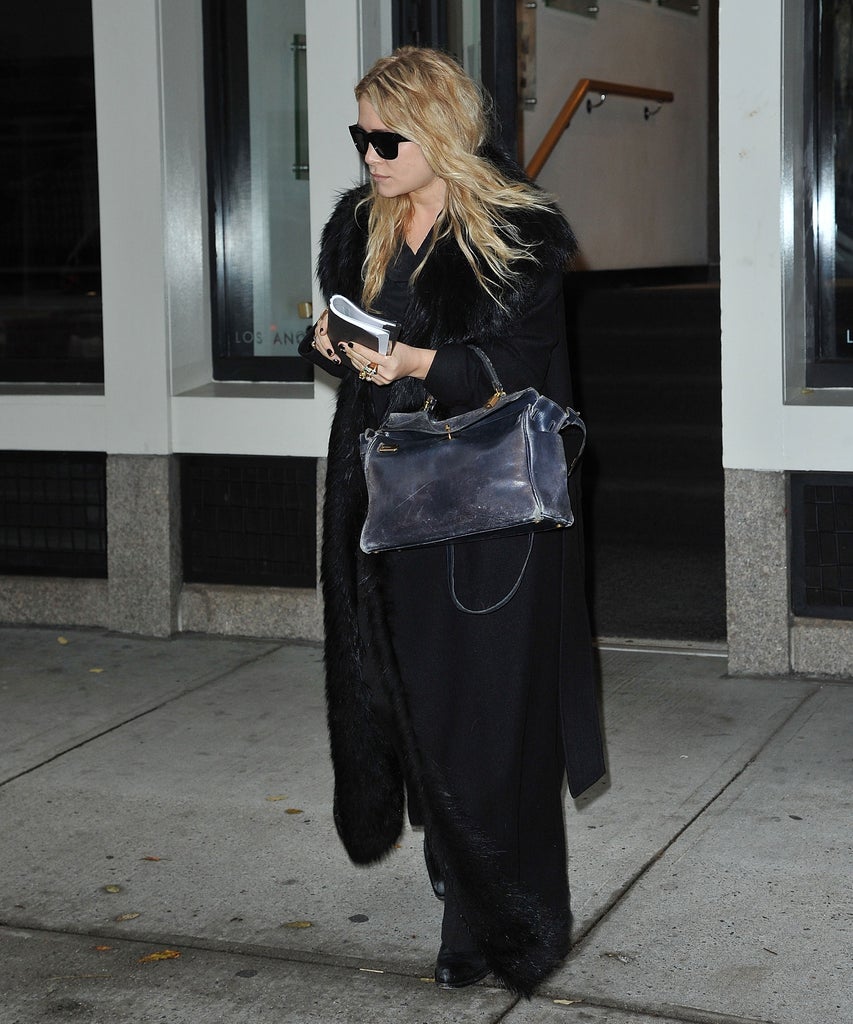 In Defence Of Worn Out & Used Handbags