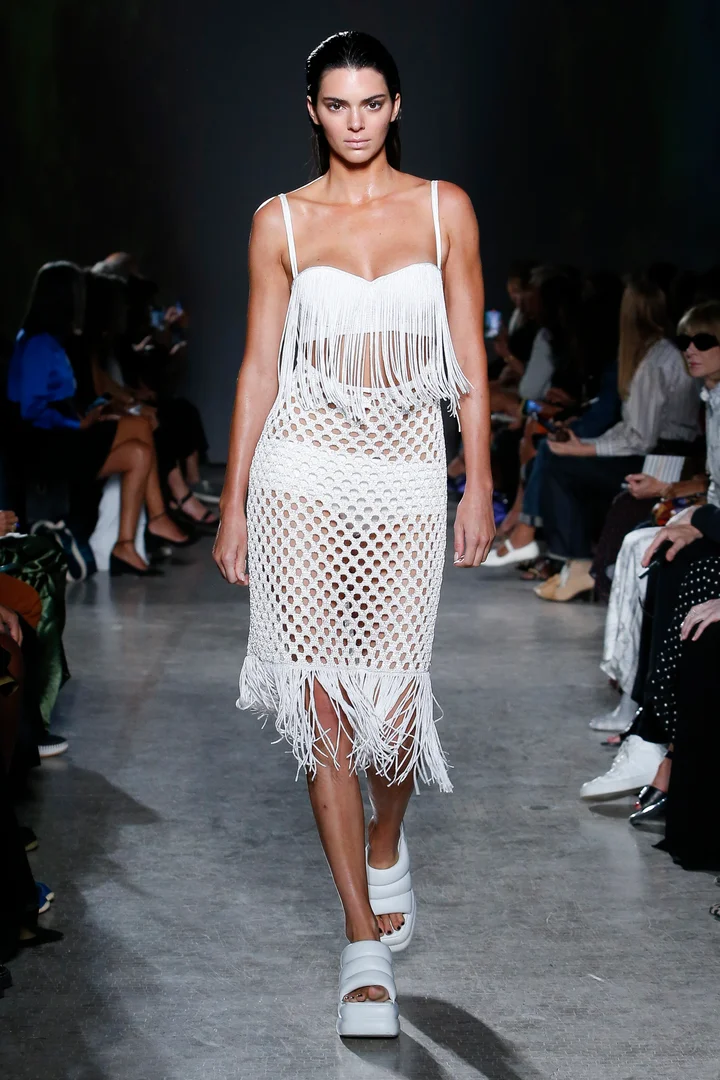 Kendall Jenner walking the Spring 2023 runway of Proenza Schouler in a crochet dress.