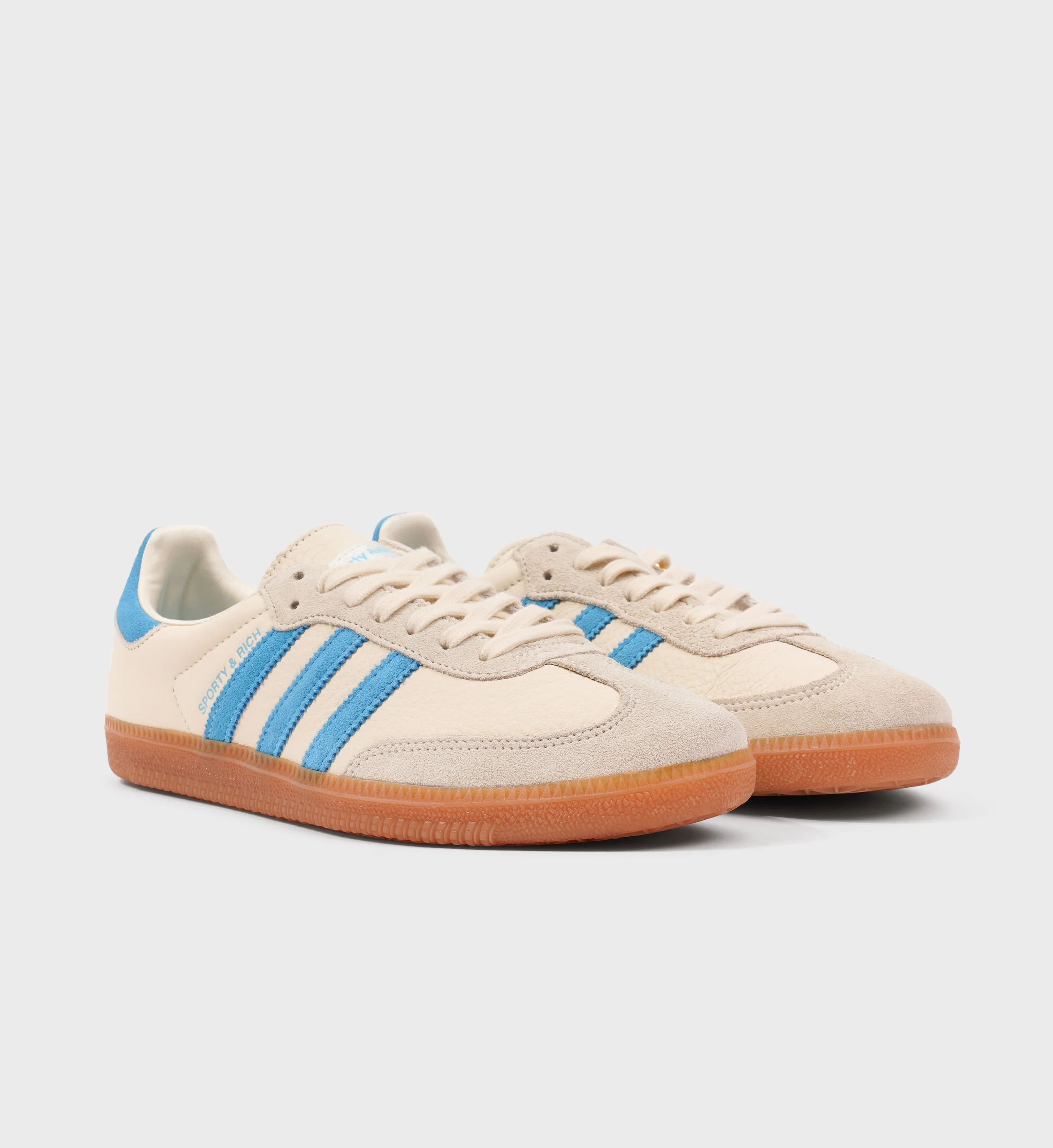 Baby blue top adidas shoes