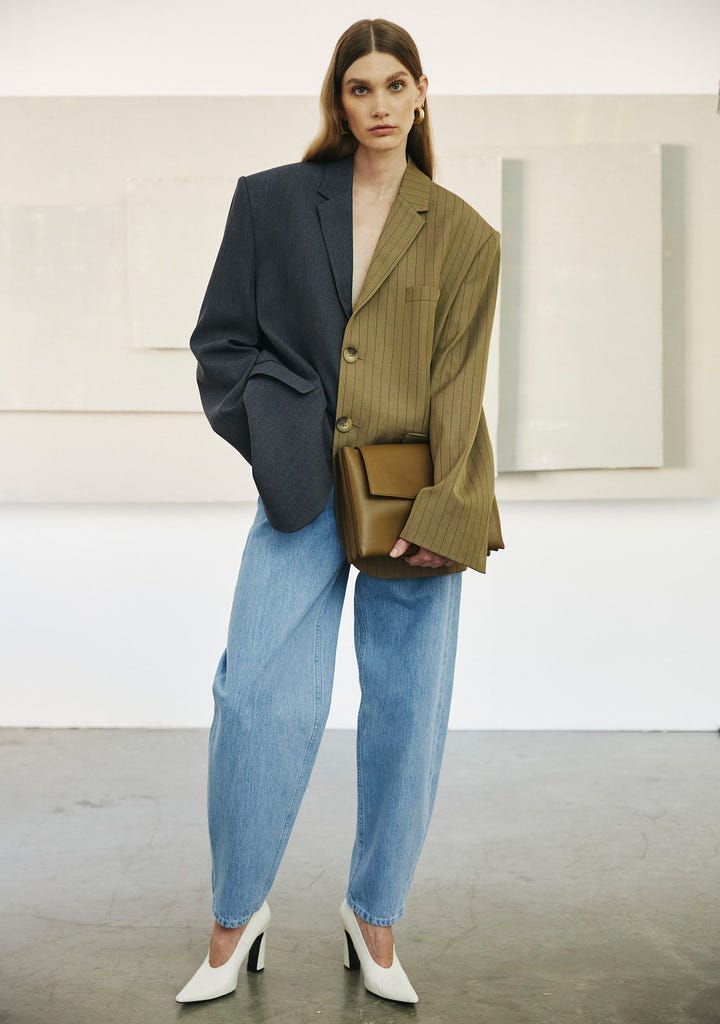 A model wearing blue Bouguessa barrel jeans