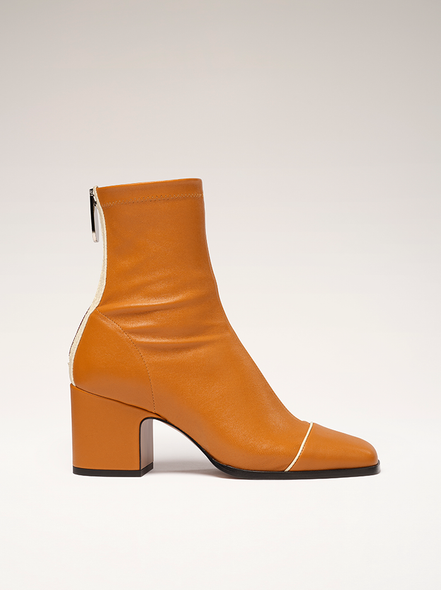 Nine west cheyin cylinder heeled best sale boots