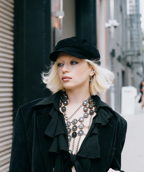 Guest at New York Fashion Week with short blonde bob haircut.