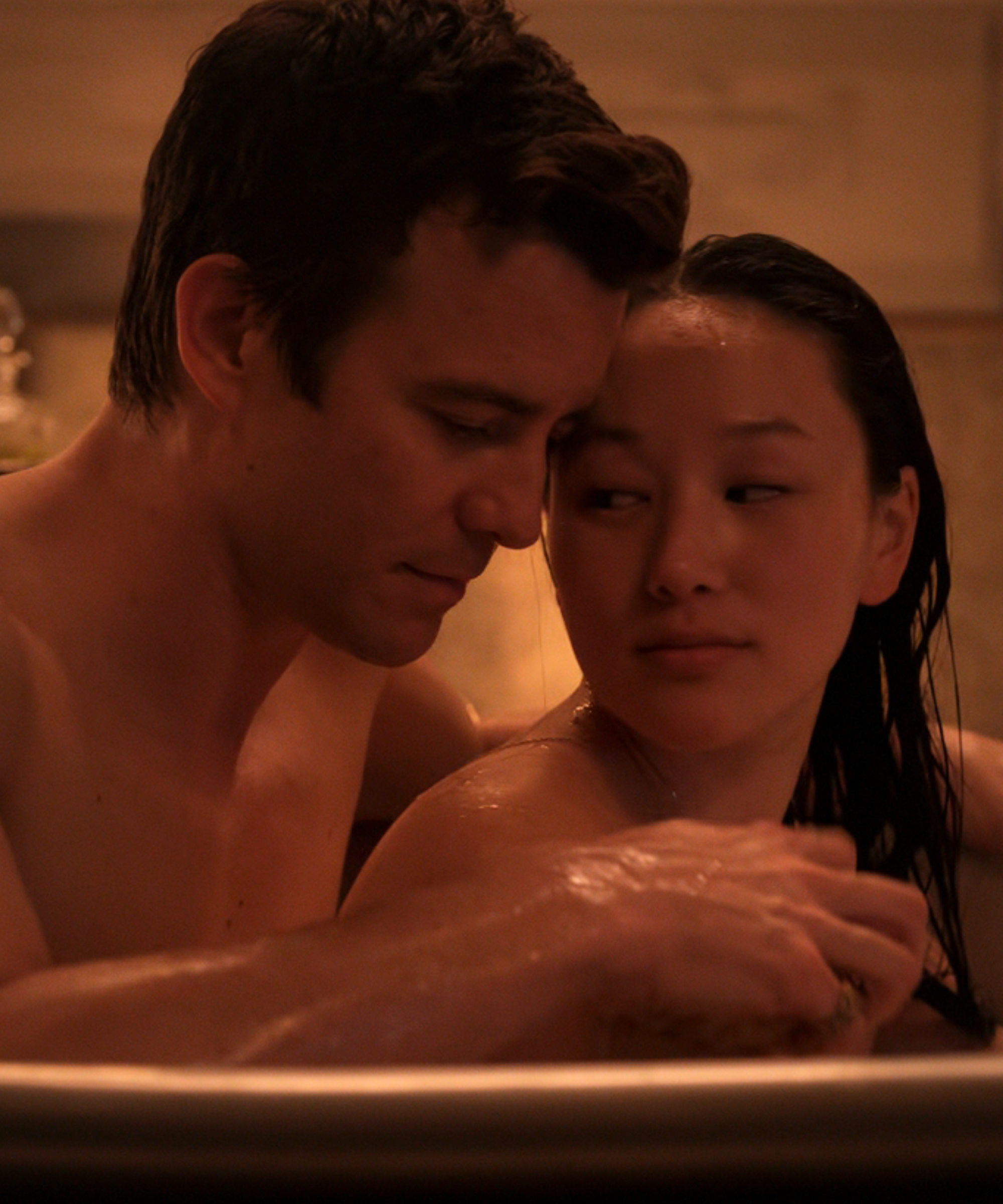 Luke Thompson as Benedict Bridgerton and Yerin Ha as Sophie Baek in Bridgerton Season 4 Part 2 bathtub scene.