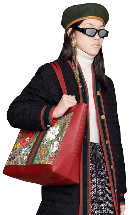 Woman holding a Gucci tote