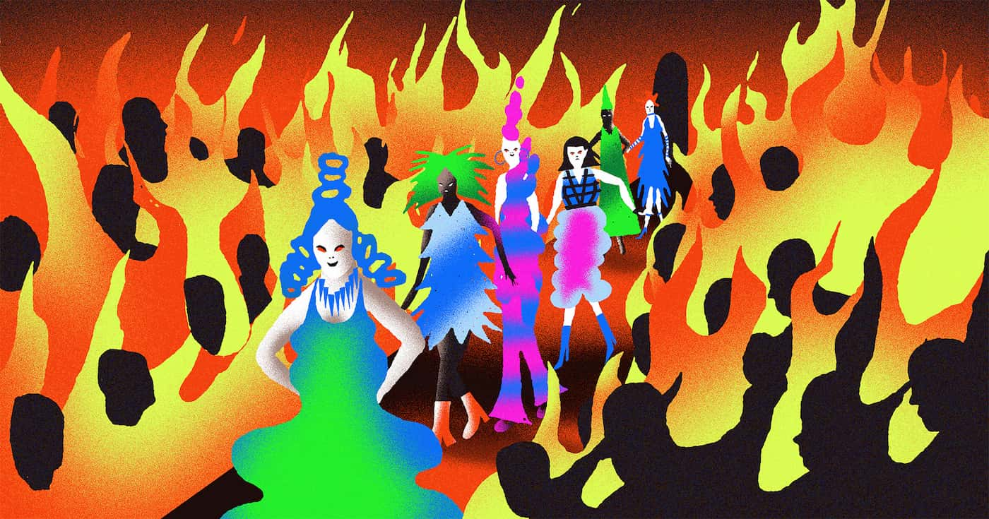 Fashion models walking down the runway that is engulfed in flames