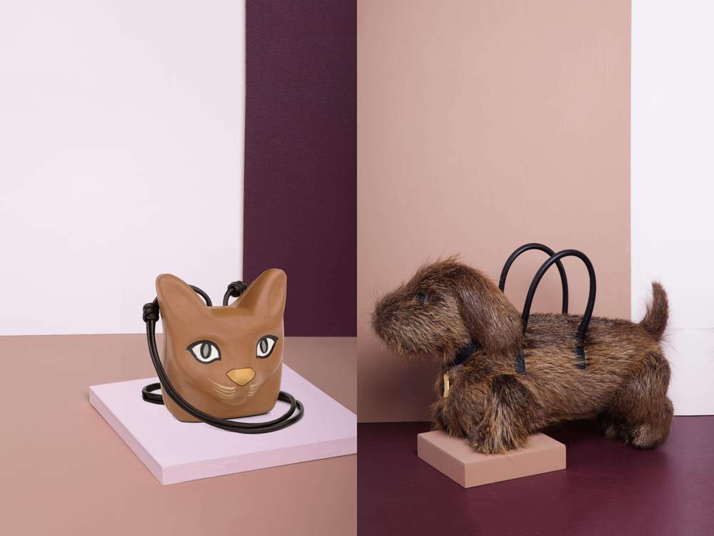photographed by erin yamagata.Loewe Cat Head Necklace, $750, available at Loewe;Thom Browne handbag, AVAILABLE AT thom browne. photographed by erin yamagata.Loewe Cat Head Necklace, $750, available at Loewe;Thom Browne handbag, AVAILABLE AT thom browne.